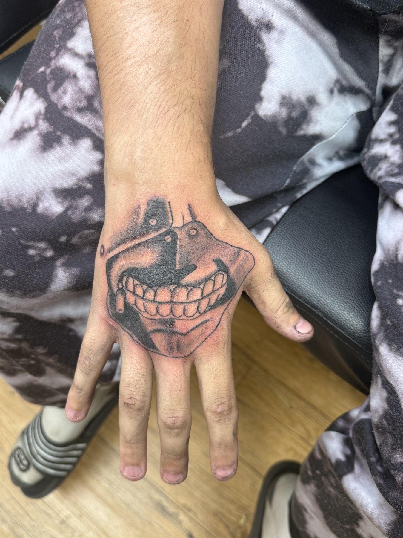 Mask hand tattoo